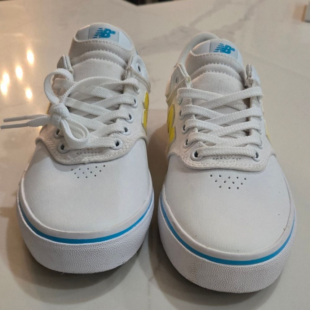 New Balance Mens/Womens White  Sneakers with Blue and Yellow Accents,  Size 8.